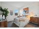 Cozy bedroom featuring stylish décor, a comfortable bed, and modern furnishings at 5806 E Axle Ln, San Tan Valley, AZ 85140