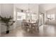 Cozy dining area filled with natural light, featuring a chandelier and sliding door access at 5830 E Mckellips Rd # 101, Mesa, AZ 85215