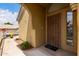 View of covered front door, featuring security door, and a 'Bless This Home' welcome mat at 5830 E Mckellips Rd # 101, Mesa, AZ 85215