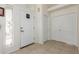 Bright foyer with tile flooring, a front door, and closet doors creating an inviting entrance at 5830 E Mckellips Rd # 101, Mesa, AZ 85215