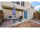 Cozy backyard patio with seating, grill, and direct access to the home's back door at 5923 W Townley Ave, Glendale, AZ 85302