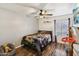 Cozy bedroom with a ceiling fan and basketball hoop at 5923 W Townley Ave, Glendale, AZ 85302