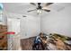 Bedroom with a ceiling fan, double door closet, and warm lighting at 5923 W Townley Ave, Glendale, AZ 85302