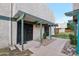 Charming building facade with gated entrances, covered walkway, and minimal landscaping at 5923 W Townley Ave, Glendale, AZ 85302