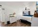 Bright main bedroom featuring updated flooring and a ceiling fan at 5923 W Townley Ave, Glendale, AZ 85302