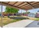 The backyard includes a covered patio, a playground, a trampoline, and a storage shed at 6814 N 14Th St, Phoenix, AZ 85014