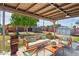 Inviting outdoor patio area with comfortable seating, a barbecue grill, and a spacious backyard perfect for entertaining at 6814 N 14Th St, Phoenix, AZ 85014
