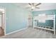 This bedroom has a bunk bed, soft gray carpeting, a ceiling fan, and bright, airy atmosphere at 6814 N 14Th St, Phoenix, AZ 85014