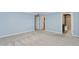 Light and airy bedroom with soft blue walls and an en-suite bathroom at 6814 N 14Th St, Phoenix, AZ 85014
