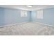 Bright bedroom with new carpet, crown moulding, and white plantation shutters at 6814 N 14Th St, Phoenix, AZ 85014