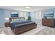 Serene bedroom with soft blue walls, plantation shutters, plush bedding, and ample space for relaxation at 6814 N 14Th St, Phoenix, AZ 85014