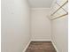 Walk-in closet with wood-look flooring and a wire shelving system at 6814 N 14Th St, Phoenix, AZ 85014