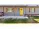 Up close view of home's front door with wooden shutters and porch at 6814 N 14Th St, Phoenix, AZ 85014