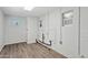 The laundry room features durable wood flooring and white brick walls with updated utilities at 6814 N 14Th St, Phoenix, AZ 85014