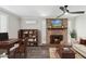 Comfortable living area featuring a brick fireplace, built in shelves, and cozy seating for relaxing and entertaining at 6814 N 14Th St, Phoenix, AZ 85014