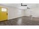 Bright living room featuring modern ceiling fans, neutral walls and sleek flooring at 6814 N 14Th St, Phoenix, AZ 85014