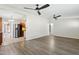 Open-concept living room with sleek floors seamlessly connects to the kitchen area at 6814 N 14Th St, Phoenix, AZ 85014
