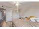 Well-lit bedroom includes a ceiling fan and spacious wardrobe closet at 6960 W Berkeley Rd, Phoenix, AZ 85035