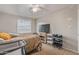 Bedroom features a ceiling fan, tile floors, a window, and a TV at 6960 W Berkeley Rd, Phoenix, AZ 85035