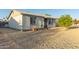 Charming single-story home with low maintenance desert landscaping and security door at 6960 W Berkeley Rd, Phoenix, AZ 85035
