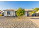 Charming single-story home with low maintenance desert landscaping and covered parking at 6960 W Berkeley Rd, Phoenix, AZ 85035