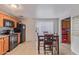 Eat-in kitchen features tile floors, granite counters, and stainless steel appliances at 6960 W Berkeley Rd, Phoenix, AZ 85035