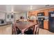 Open concept kitchen with tile floors, an eat-in table, and seating area at 6960 W Berkeley Rd, Phoenix, AZ 85035