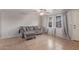 Comfortable living room with tile floors, ceiling fan, and cozy sofa at 6960 W Berkeley Rd, Phoenix, AZ 85035