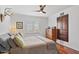 Comfortable bedroom with hardwood floors, a ceiling fan, and neutral decor at 710 E Hayward Ave, Phoenix, AZ 85020
