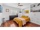 Bright bedroom with hardwood floors, built-in shelving, and ample storage at 710 E Hayward Ave, Phoenix, AZ 85020