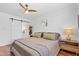 Bedroom featuring hardwood floors, a ceiling fan, and unique decor at 710 E Hayward Ave, Phoenix, AZ 85020