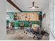 Spacious bonus room featuring instruments, a ceiling fan, and modern decor for entertaining and hobbies at 710 E Hayward Ave, Phoenix, AZ 85020