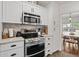 Kitchen view highlighting the stainless steel oven and white cabinets at 710 E Hayward Ave, Phoenix, AZ 85020
