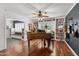 Stylish music room showcasing a piano, guitar collection, and custom bookshelves at 710 E Hayward Ave, Phoenix, AZ 85020