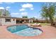 Beautiful backyard featuring a kidney-shaped pool, lounge chairs, mature trees, and lush landscaping at 710 E Hayward Ave, Phoenix, AZ 85020