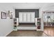 Cozy room featuring a window seat, built-in bookcases, and a decorative wall at 710 E Hayward Ave, Phoenix, AZ 85020