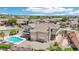 Aerial view of a home featuring a pool, patio, and landscaped backyard, perfect for outdoor living at 7472 E Black Rock Rd, Scottsdale, AZ 85255