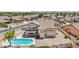 Aerial view of a home featuring a pool, patio, and landscaped backyard, perfect for outdoor living at 7472 E Black Rock Rd, Scottsdale, AZ 85255
