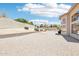 Large backyard with desert landscaping, block fencing, and a view of the house at 7472 E Black Rock Rd, Scottsdale, AZ 85255