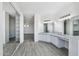Bright primary bathroom with double vanity, a makeup area, and ample mirror space at 7472 E Black Rock Rd, Scottsdale, AZ 85255