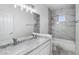 This bright bathroom has marble countertops and a tub with tile surround at 7472 E Black Rock Rd, Scottsdale, AZ 85255