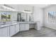 Spacious primary bathroom with marble countertop, double sinks, and plenty of light from the large window at 7472 E Black Rock Rd, Scottsdale, AZ 85255