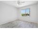 This bright bedroom has tile flooring, ceiling fan and a view from the window at 7472 E Black Rock Rd, Scottsdale, AZ 85255