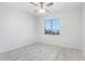 This bright bedroom has tile flooring, ceiling fan and a view from the window at 7472 E Black Rock Rd, Scottsdale, AZ 85255