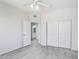 The bright bedroom offers a ceiling fan, tile floor, closet and access to the ensuite bathroom at 7472 E Black Rock Rd, Scottsdale, AZ 85255