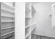 Organized walk-in closet with built-in shelving and ample hanging space, ready for your wardrobe at 7472 E Black Rock Rd, Scottsdale, AZ 85255