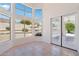 Bright dining room with tile floors, many windows, and French doors overlooking the backyard at 7472 E Black Rock Rd, Scottsdale, AZ 85255