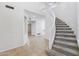 Open foyer with curved staircase, tile flooring, and neutral color palette at 7472 E Black Rock Rd, Scottsdale, AZ 85255