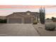 Charming two-story home with a three-car garage, desert landscaping, and inviting curb appeal at 7472 E Black Rock Rd, Scottsdale, AZ 85255