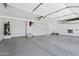 Spacious garage features epoxy flooring, ample storage, and well-lit interiors at 7472 E Black Rock Rd, Scottsdale, AZ 85255